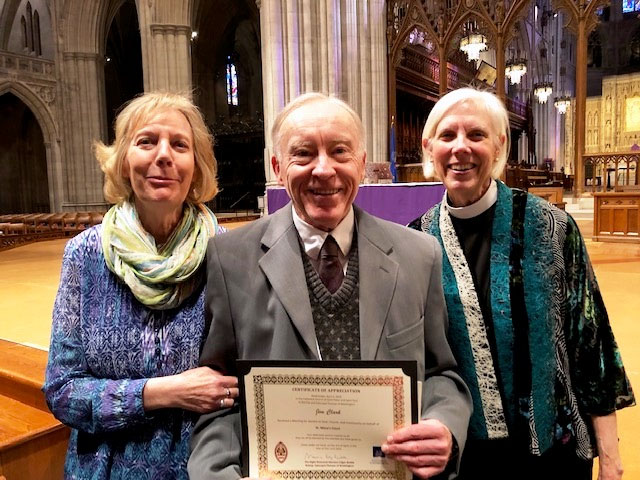 three elders with a certificate